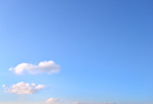 Fluffy clouds in the clear winter sky