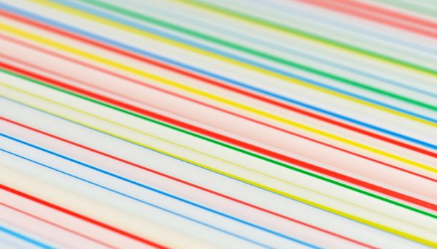 Many colorful drinking straws