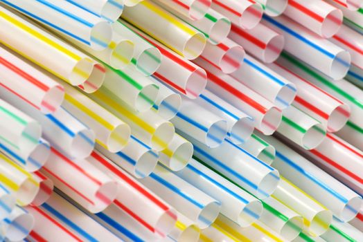 Many colorful drinking straws