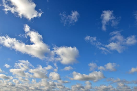 Fluffy clouds in the otherwise clear sky