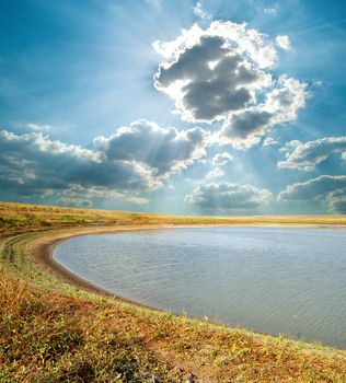 pond under cloudy sky