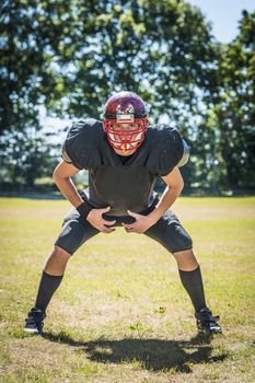 picture of concentrated american football player in position