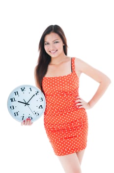 Portrait of an attractive young woman holding a clock over white background