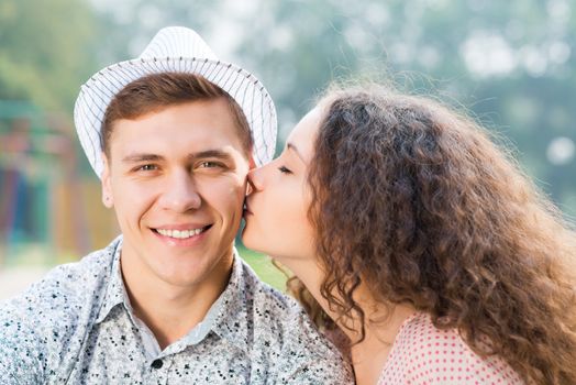 girl kissing a man on the cheek, spending time with loved ones