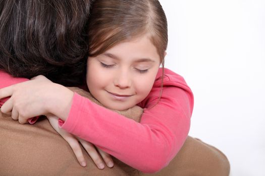 Mother and daughter hugging