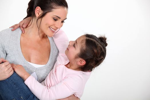 Woman holding her little girl