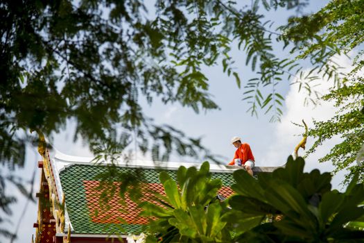 A Man repair roof of Temple