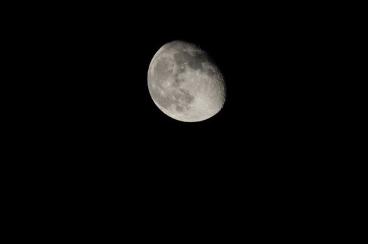 Almost Full Moon over a Dark Black Sky