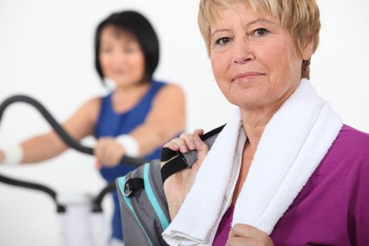 Women using gym equipment