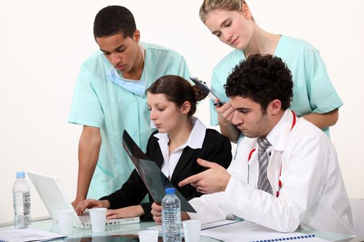 hospital staff analyzing a case