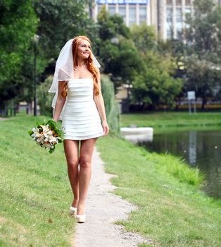 Beautiful red hair bride wearing wedding dress