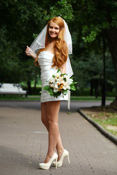 Beautiful red hair bride wearing wedding dress