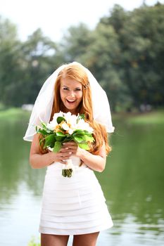 Portrait of beautiful bride with flowers