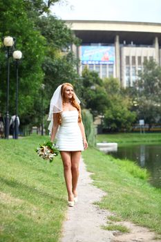 Beautiful red hair bride wearing wedding dress