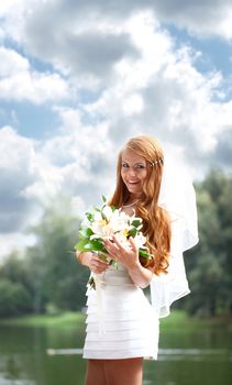 Portrait of beautiful bride with flowers