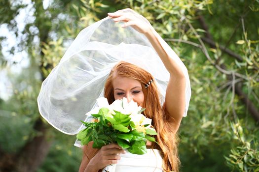 Portrait of beautiful bride with flowers