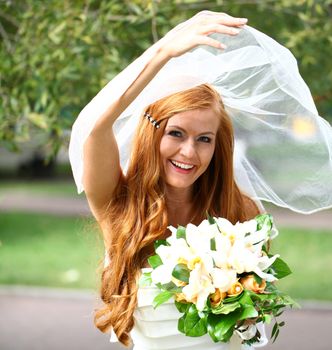 Portrait of beautiful bride with flowers