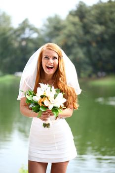 Portrait of beautiful bride with flowers