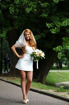 Beautiful red hair bride wearing wedding dress