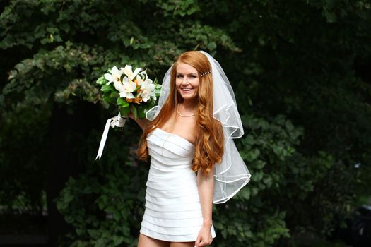 Portrait of beautiful bride with flowers