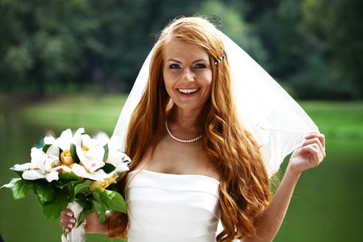 Portrait of beautiful bride with flowers