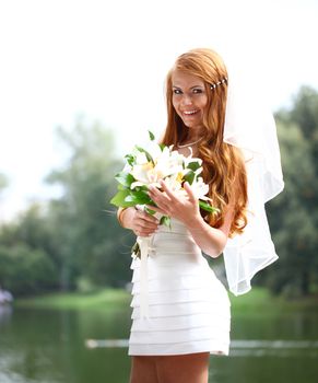 Portrait of beautiful bride with flowers