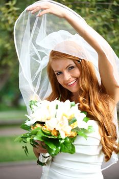 Portrait of beautiful bride with flowers