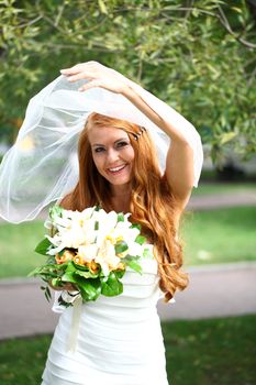 Portrait of beautiful bride with flowers