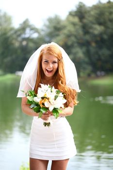 Portrait of beautiful bride with flowers