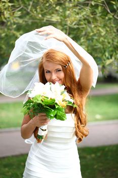 Portrait of beautiful bride with flowers