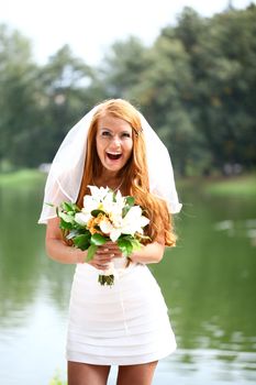 Portrait of beautiful bride with flowers