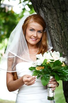 Portrait of beautiful bride with flowers