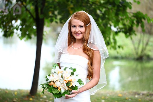 Portrait of beautiful bride with flowers