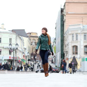 Full length, Walking woman in autumn Moscow street