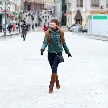 Full length, Walking woman in autumn Moscow street