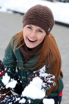 Happy young woman in winter city