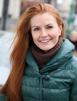 Happy young woman in autumn city