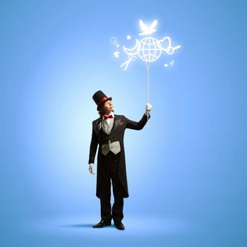 Image of magician in hat holding globe. Ecology concept