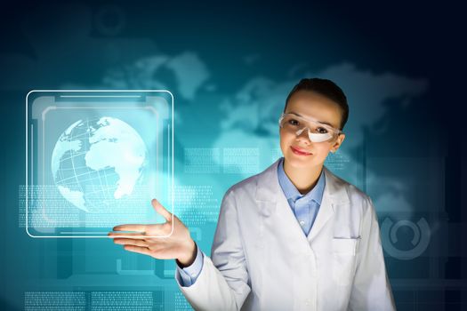Image of young woman scientist in goggles against media screen