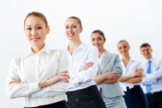 Group of businesspeople smiling standing with arms crossed