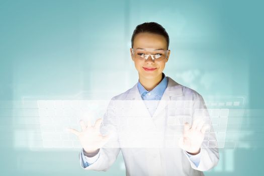 Image of young woman scientist touching icon of media screen