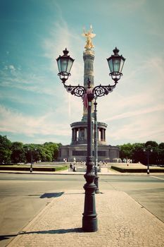 The Victory Column behind the lamppost in Berlin, Germany. Berlin Siegessaule also called Goldelse