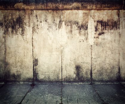 Grunge, rusty concrete wall and concrete floor. Grunge background