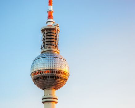 Tv tower or Fersehturm in Berlin, Germany at sunset. Close up