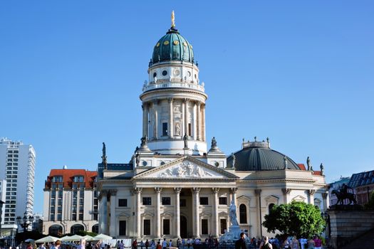 The Gendarmenmarkt. German Cathedral in Berlin, sunny blue sky