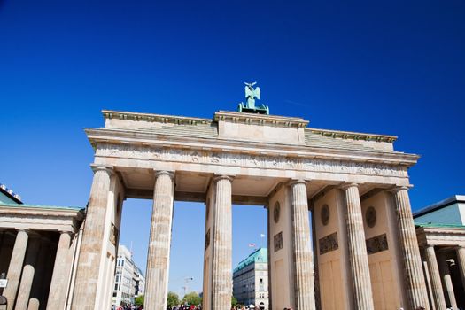 Brandenburg Gate. German Brandenburger Tor in Berlin, Germany. Sunny blue sky