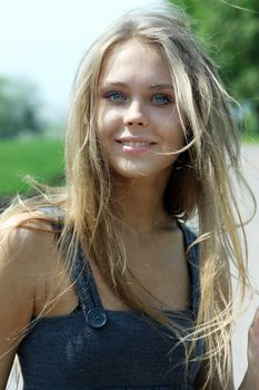 Beautiful young blonde woman. Outdoor portrait