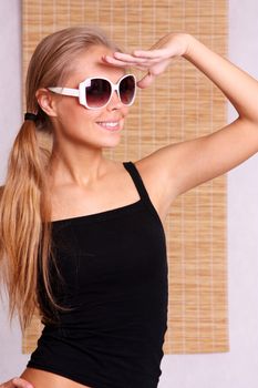 Happy young woman in sunglasses