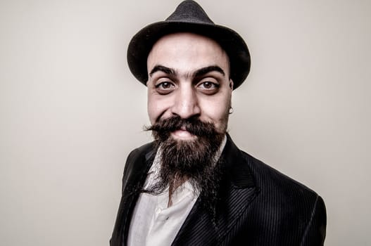 long beard and mustache hipster with elegant suit 