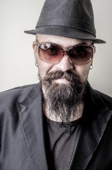 long beard and mustache hipster with elegant suit 